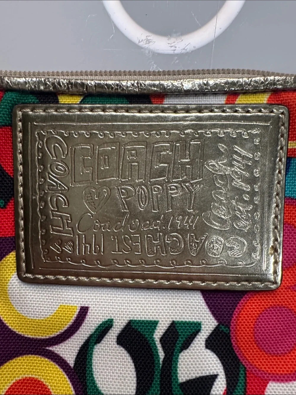 Coach Poppy Multicolor signature wristlet with gold accents and hangtag